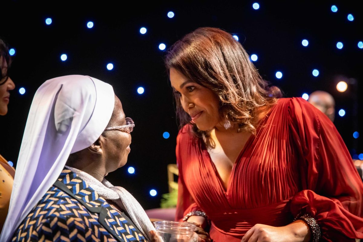 OCCC President Mautra Jones (right) finds herself captivated by Sister Rosemary Nyirumbe, a humanitarian nun in charge of a girls' school that hosted OCCC students during a service learning trip to Uganda over the summer.