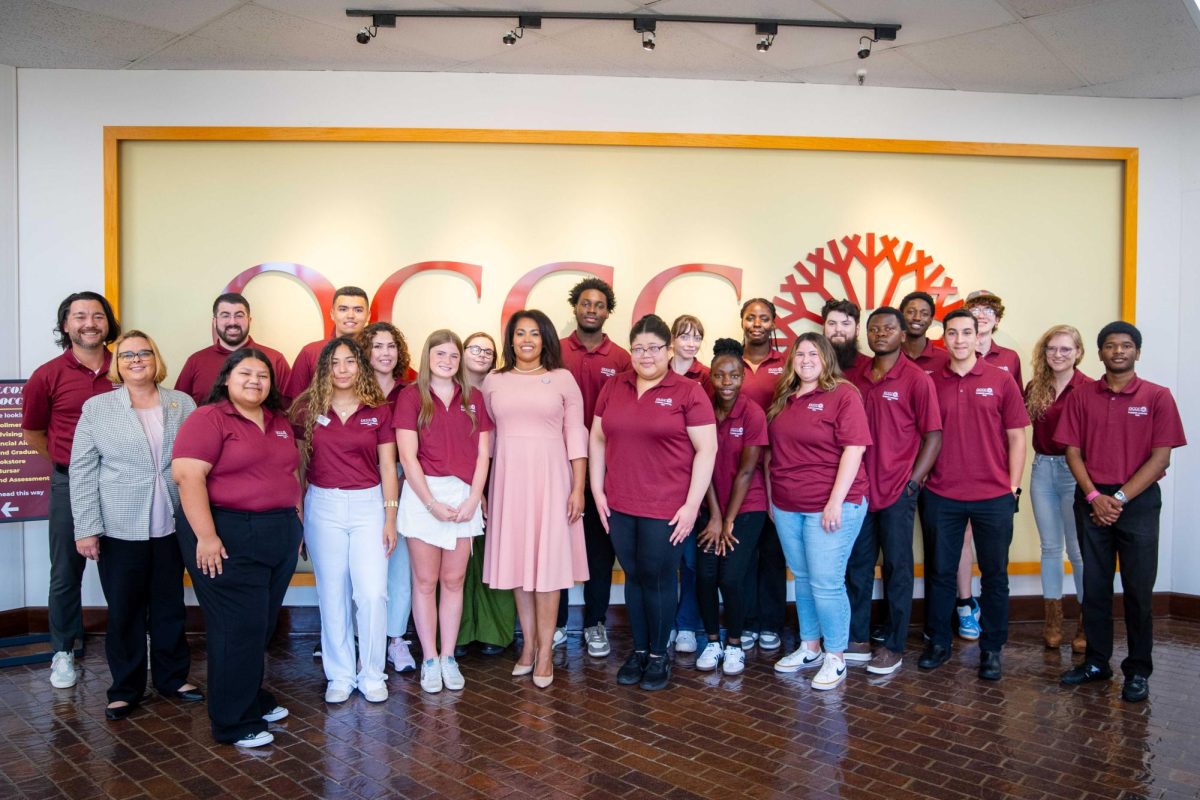 Vice President for Academic Affairs Liz Largent (left, in gray jacket) and President Mautra Jones (center, in pink dress) pose alongside members of the President's Leadership Class of 2025 for a group photo.