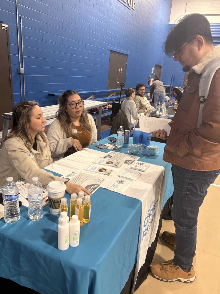 Vendors speak with an OCCC student about their organization's services at the recent SPARC fair.