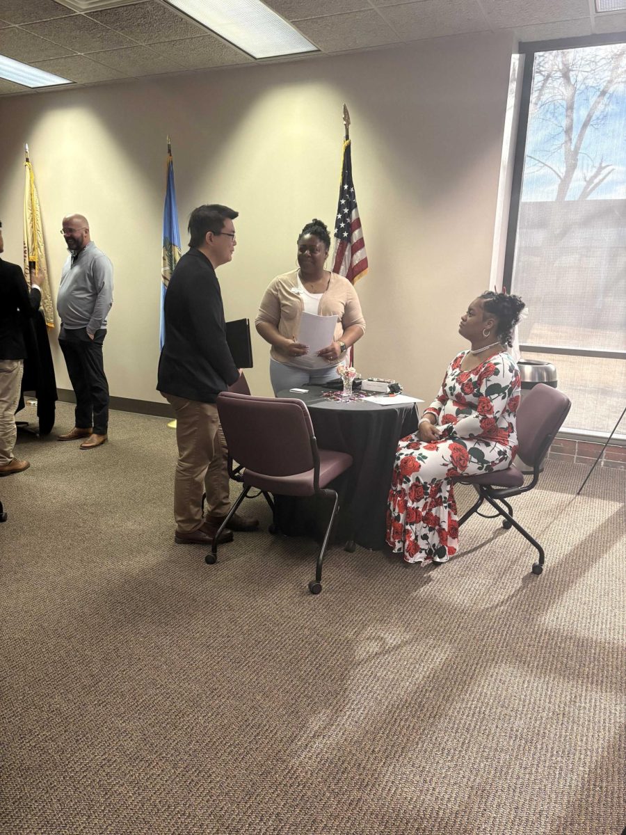 Employers at the recent "Find Your Perfect Match" networking event prepare to make connections with OCCC students on campus. 
