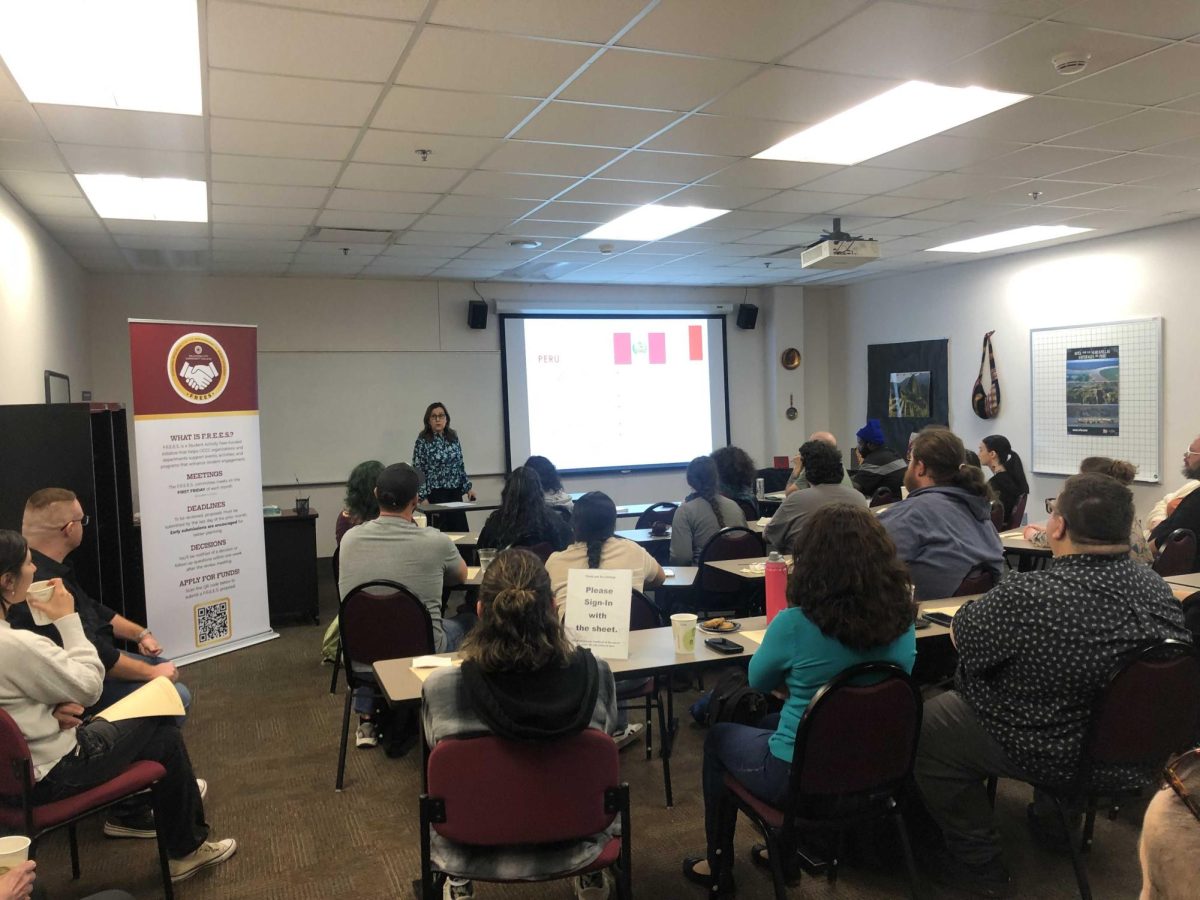 Modern Language Coordinator Hilde Votaw attracts a room full of students, faculty and staff members interested in learning more about Peru and its culture.