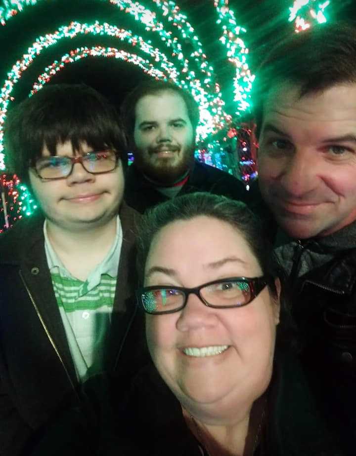 McGee family members (from left) Carson, Jonas, Shannon and Keith pose before a Yukon Christmas light display in their final family photo before father Keith passed away.