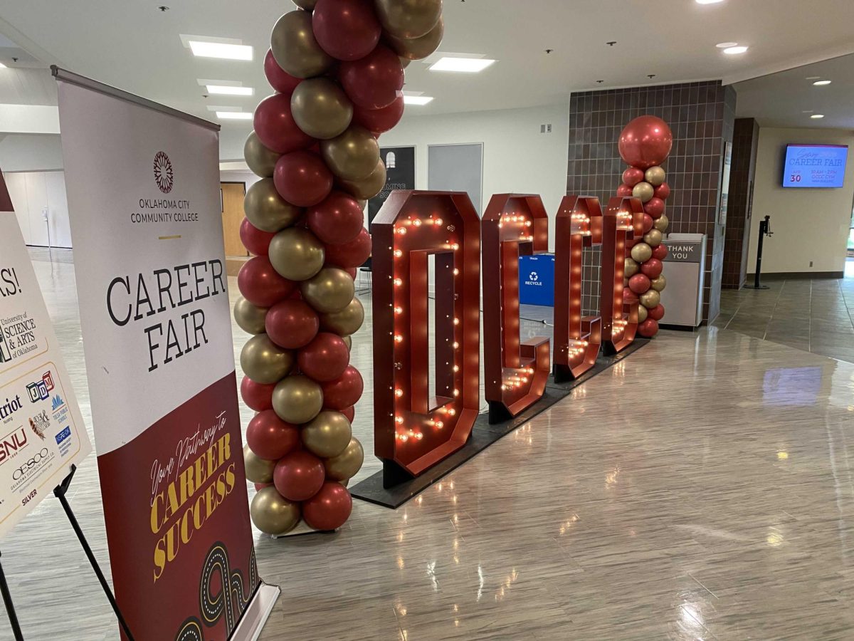 A festive entrance – complete with giant, illuminated "OCCC" marquee letters and a colorful balloon arch – welcomes students to the OCCC Spring 2026 Career Fair.